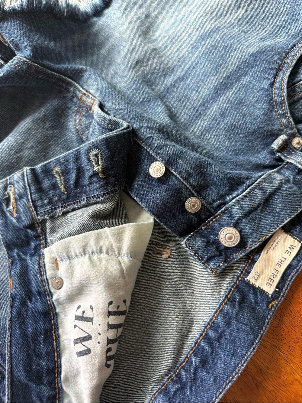 Free People women's cutoff denim shorts - button down front. Size 32 (12-14)